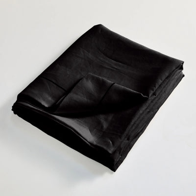 Drap plat en lin lavé Encre Noire finition bordure Bourdon